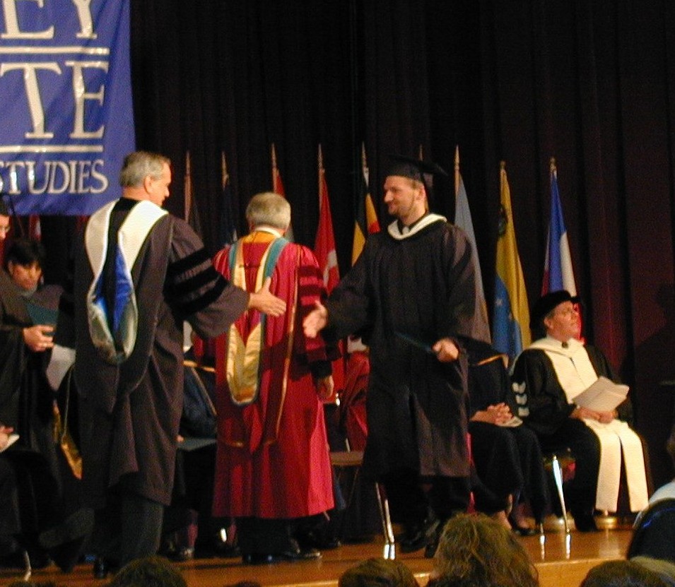 Adam Dolnik proudly receives his diploma