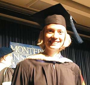 Erika Holey, returning IONP intern, receives her diploma