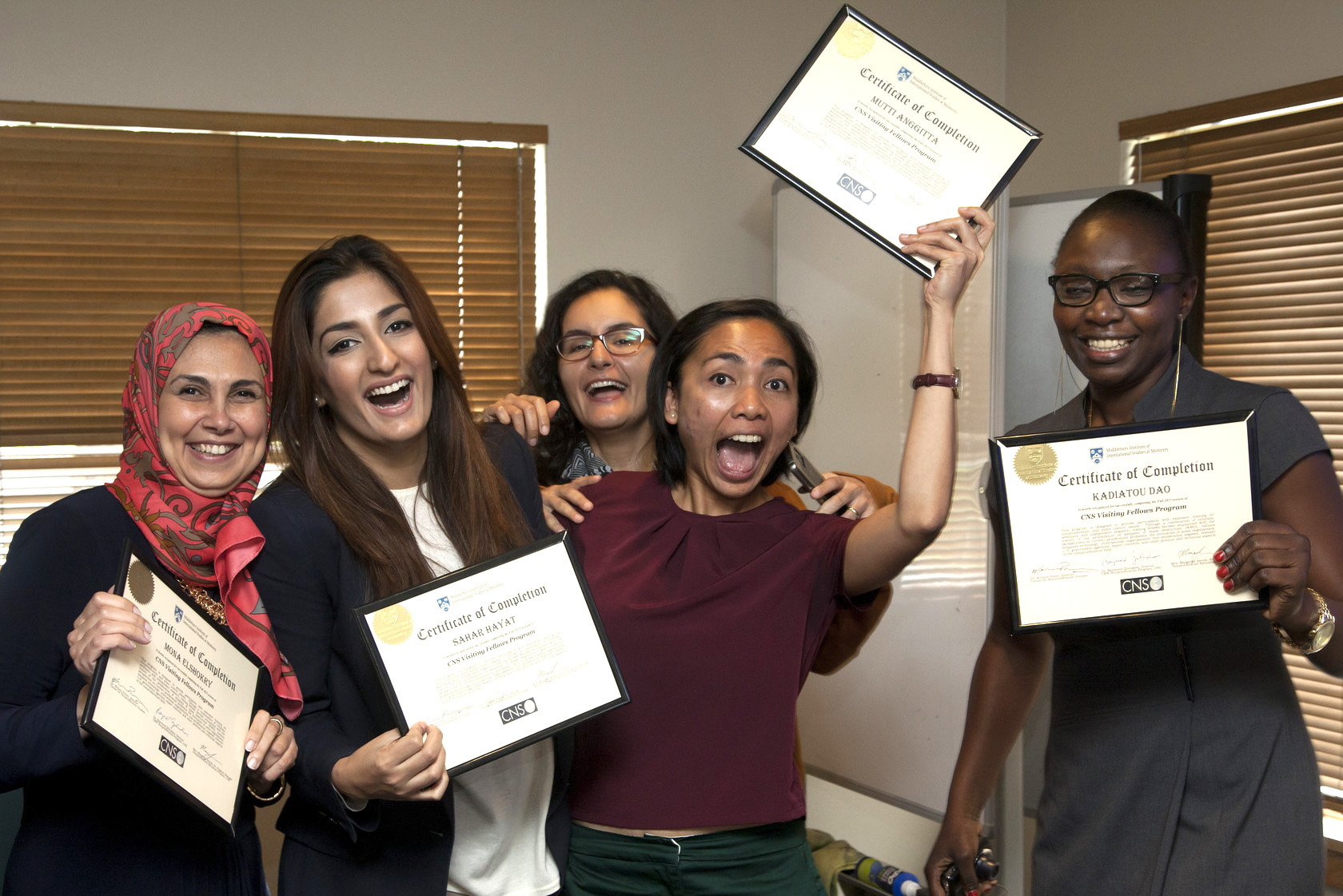 Fall 2015 fellows from Egypt, Pakistan, Indonesia, and Mali proudly display their program completion certificates.