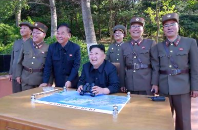 North Korea Officials with Un Laughing Image Credit Rodong Sinmun