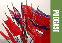 A bouquet of North Korean flags on a foggy with the word Podcast