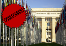 postponed burst stamp ontop of a photo of the United Nations building in Geneva