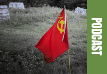 Photo of a small flag of the former Soviet Union in a field