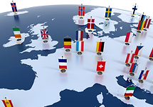 Miniature globe closeup of EU countries and ships with flags of countries