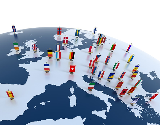 Miniature globe closeup of EU countries and ships with flags of countries