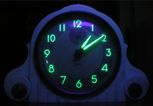 Clock's numbers and hands glow in the dark