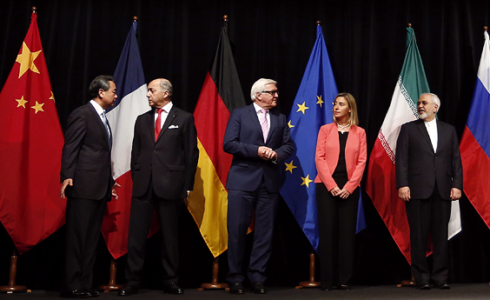 Government officials standing in front of their country's flags