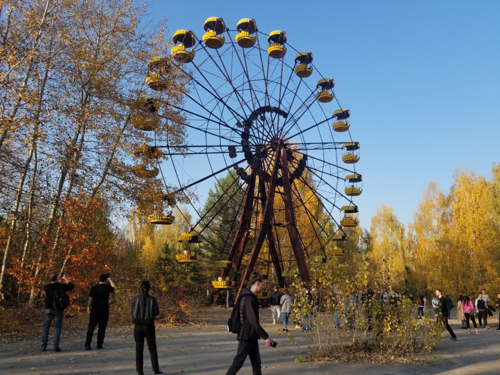 Crowds of tourists roaming around Prypyat’s iconic Ferris Wheel (Photo Credit: Margarita Kalinina-Pohl)
