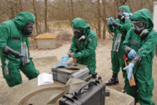 OPCW inspectors participate in a chemical weapons field exercise. (Src: opcw.org)