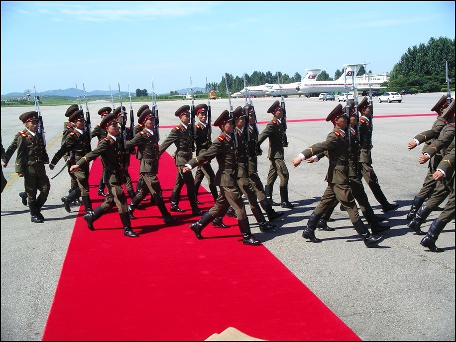 2005 Soldiers marching and red carpet laid out for VIP meeting at airport