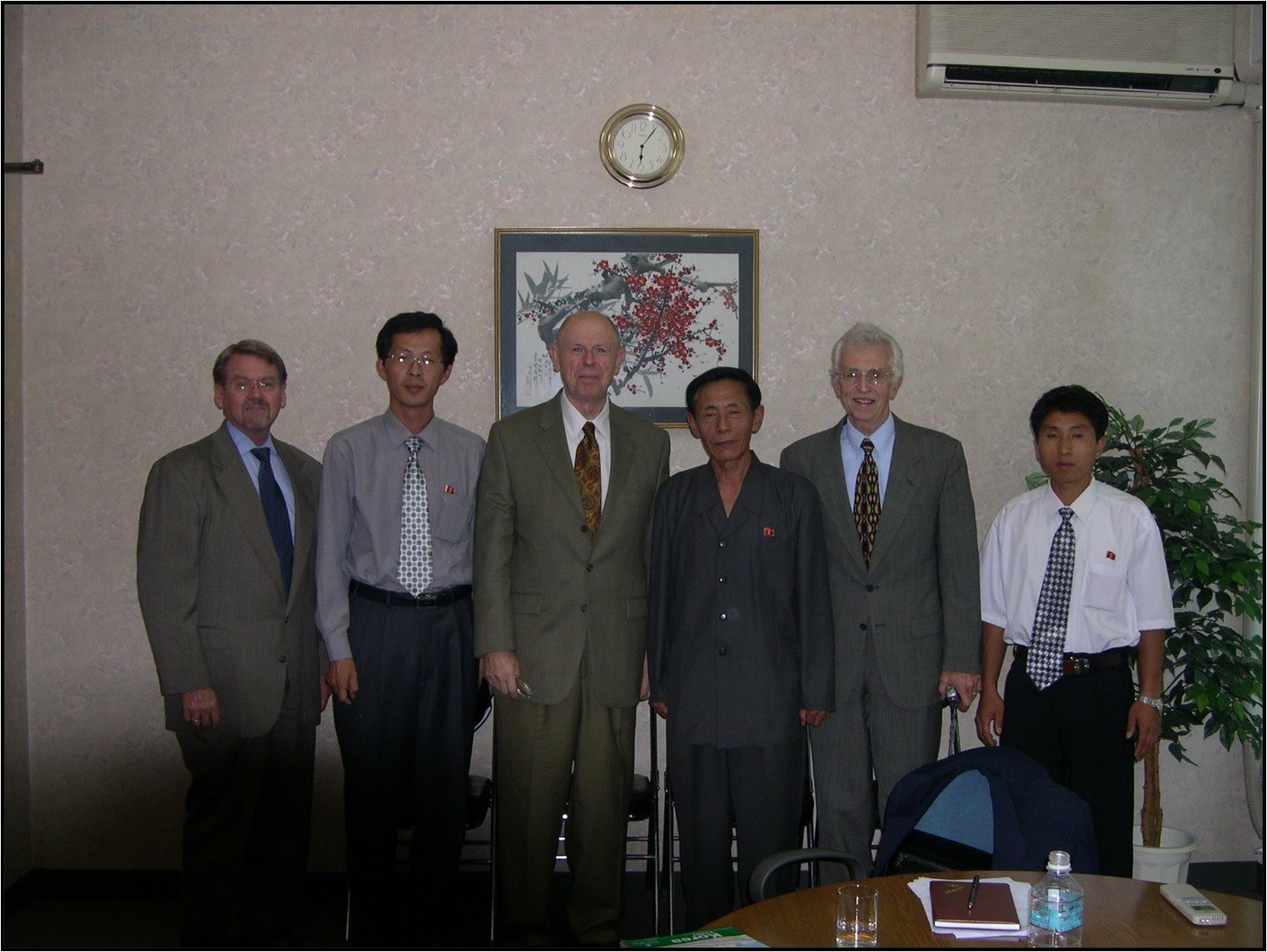 Group of North Korean hosts and Americans at a meeting in Aug. 2005
