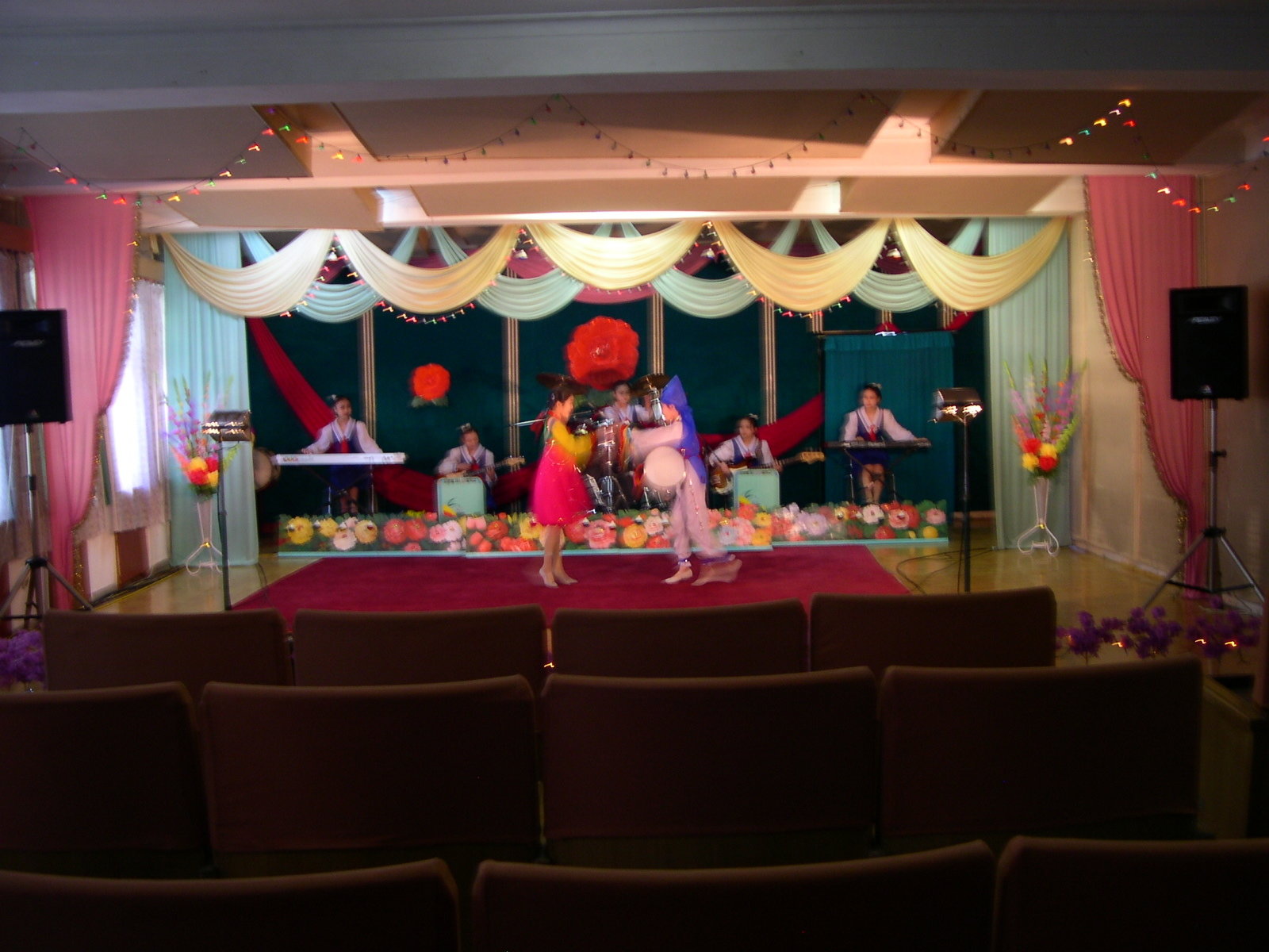 Children performing a dance on a decorated scene