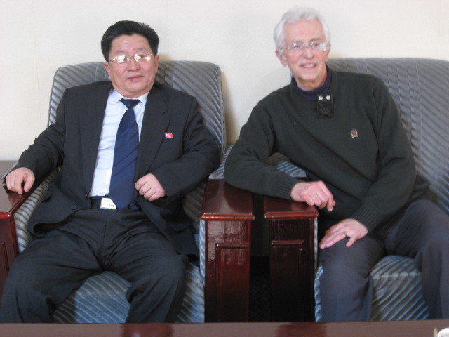 Two men in armchairs sitting next to each other