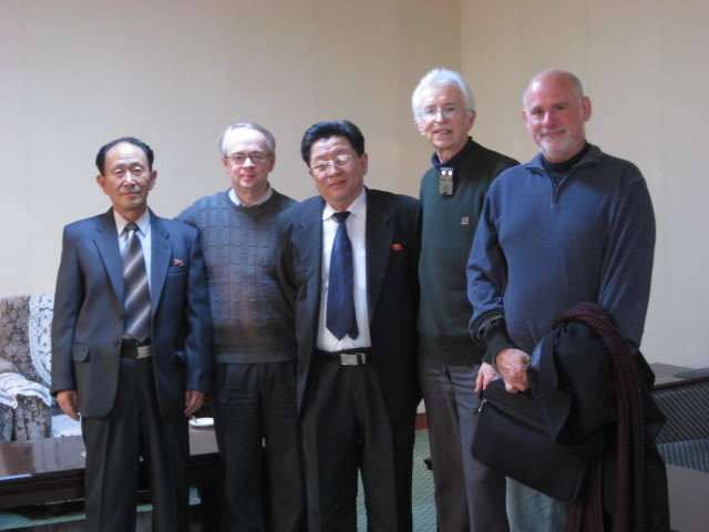 Five men posing for the photo