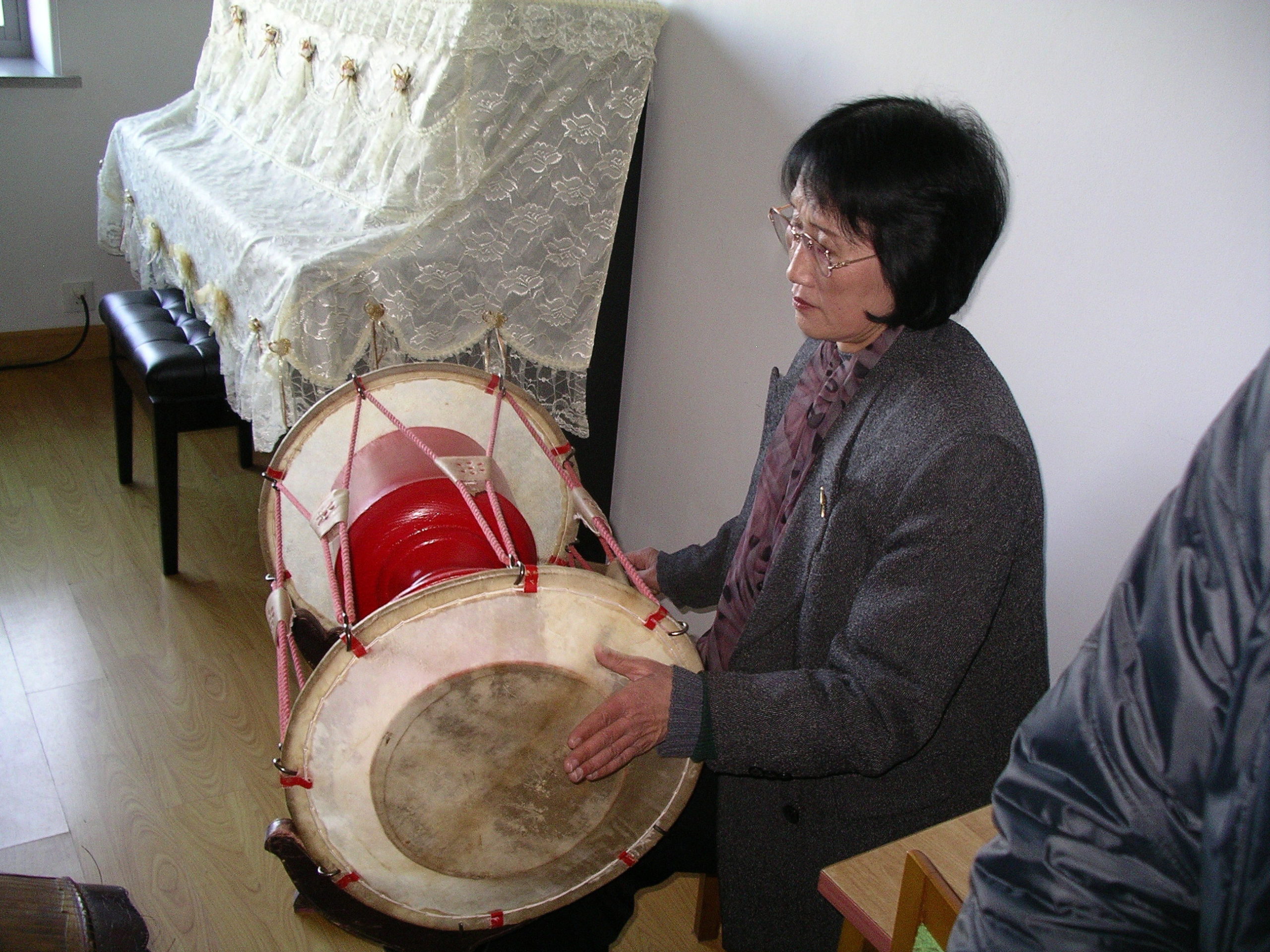 Woman playing the traditional changgu (junggu) drum.