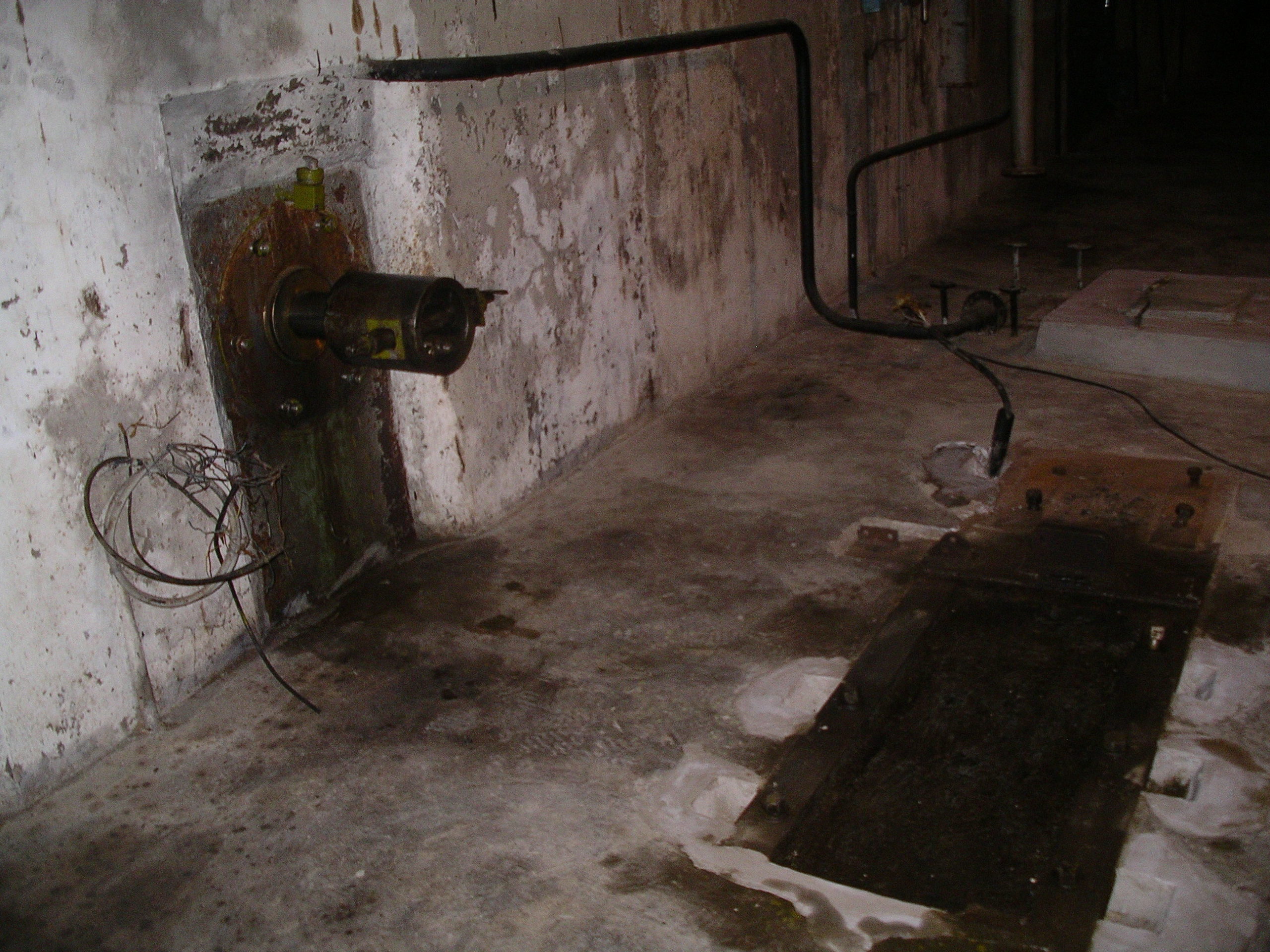 Metal structures and an orifice in the concrete floor