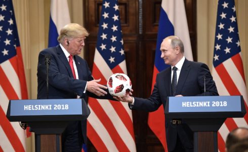 Russian President Vladimir Putin presents US President Donald Trump with a gift of a soccer ball in Helsinki on July 16, 2018. (Source: Shutterstock.com)
