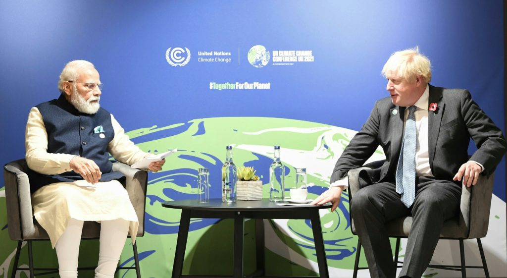 Indian Prime Minister Narendra Modi and UK Prime Minister Boris Johnson meet on November 1, 2021, during the climate summit in Glasgow. (Source: Shutterstock.com)
