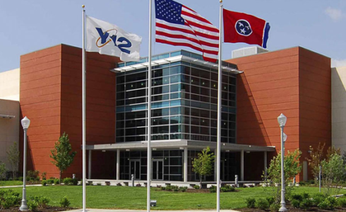 Building with 3 flags in front, Y12, US, and another