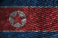 North Korea flag with computer code superimposed upon it.