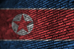 North Korea flag with computer code superimposed upon it.
