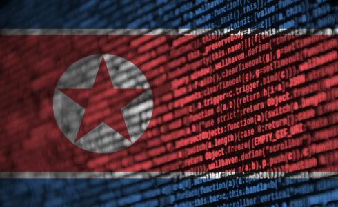 North Korea flag with computer code superimposed upon it.