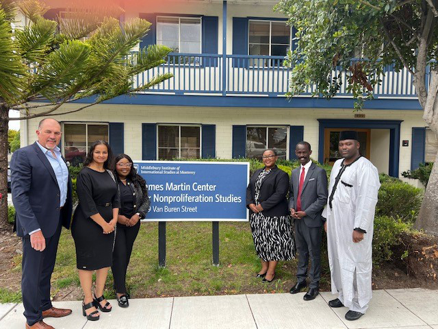 Spring 2023 fellows with program director Jean du Preez.