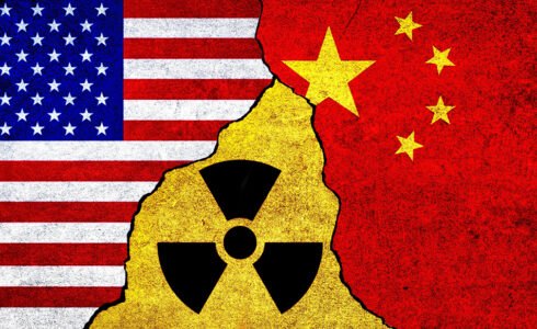 US and China flags with radiation symbol