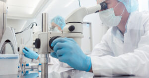 Lab technicians of scientists working on developing a vaccine against virus disease (Src: Shutterstock)