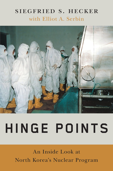 Front cover of Hinge Points book by Siegfried Hecker and Elliot Serbin featuring Hecker in hazmat suit during Yongbyon nuclear facility visit
