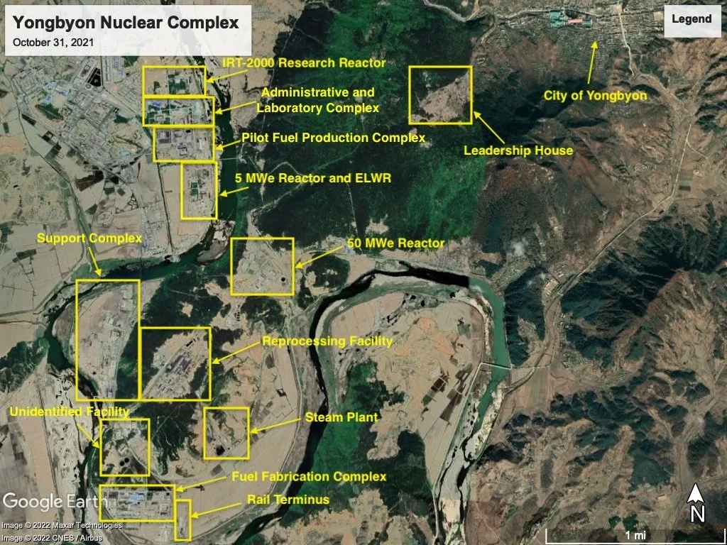 A satellite view of Yongbyon Nuclear Complex with yellow labels on facilities