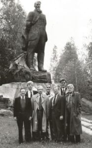 Group standing in front of a large statue