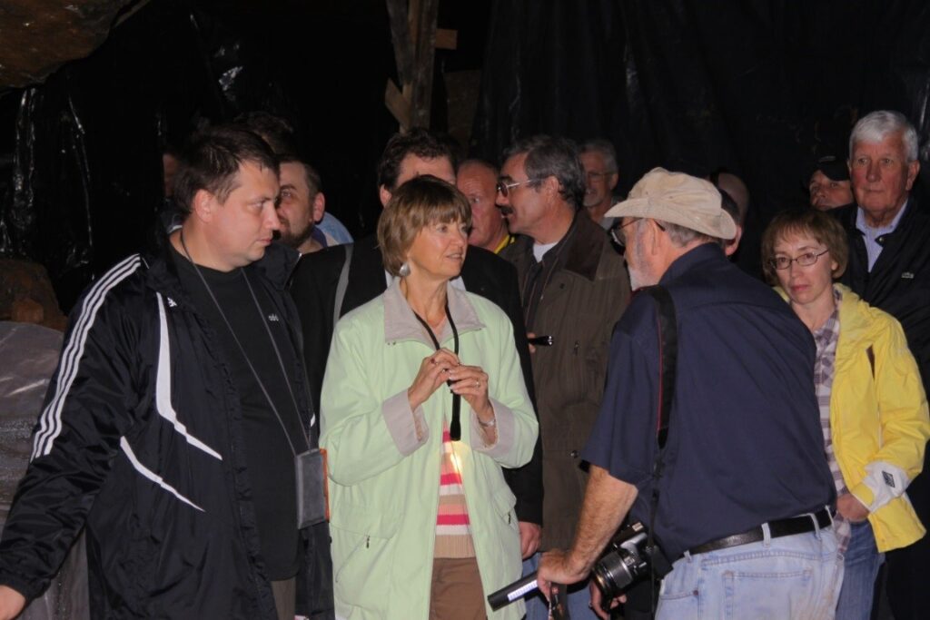 People in full discussion standing at night.