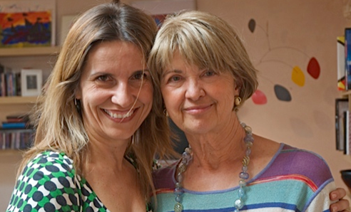 Two women smiling for the camera.