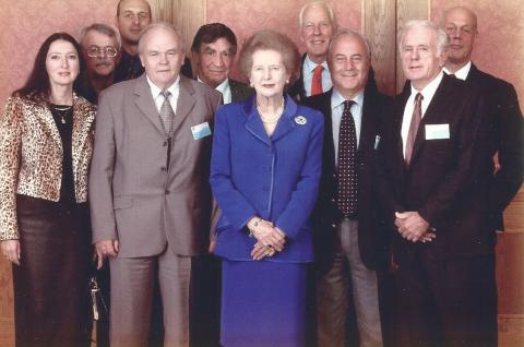 Group photo of people in suits