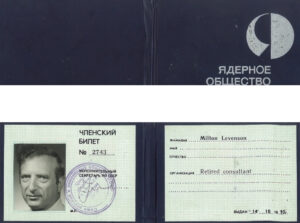 Image of a document with the photo of a man and a stamp on it.