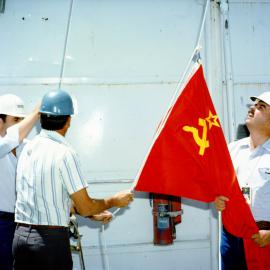 January 1988 visit of the Soviet Delegation to the NTS. Soviet flag is being raised to welcome the Soviets at the Nevada Test Site.
