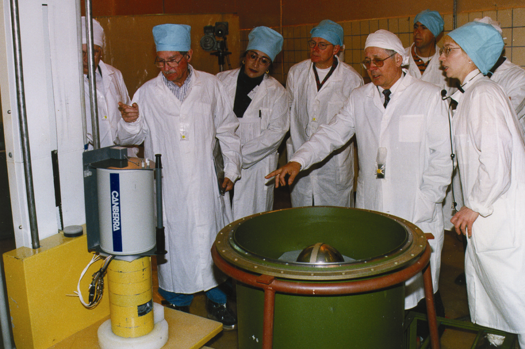 People surrounding the two pieces of equipment